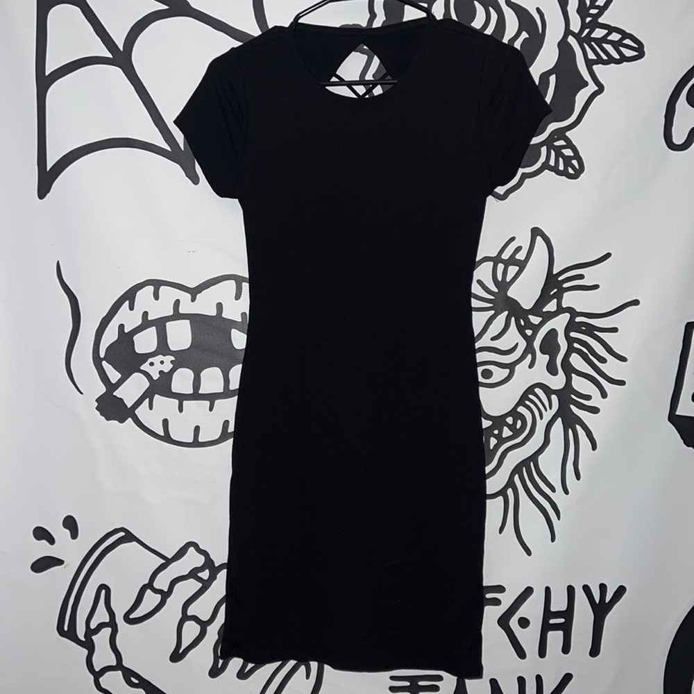 Black fitted dress with open back crisscross straps